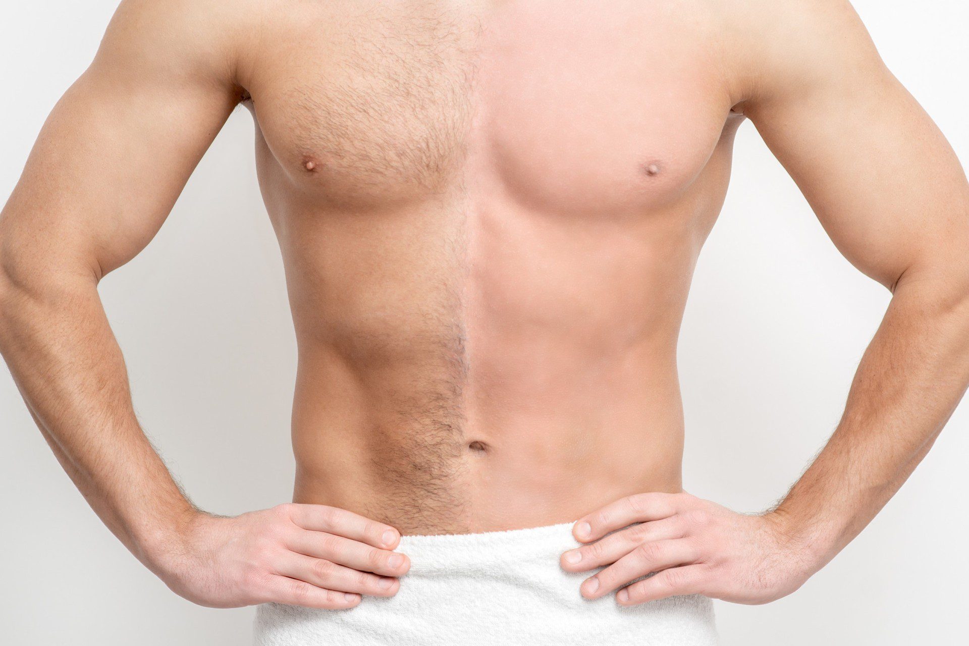 Well built man with half of chest hairless from laser hair removal